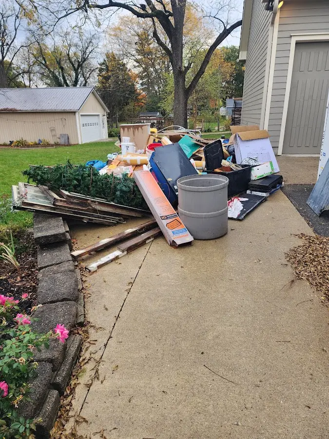 Dumpster being loaded with debris for 10 Yard Dumpster Rental in Cannon Falls